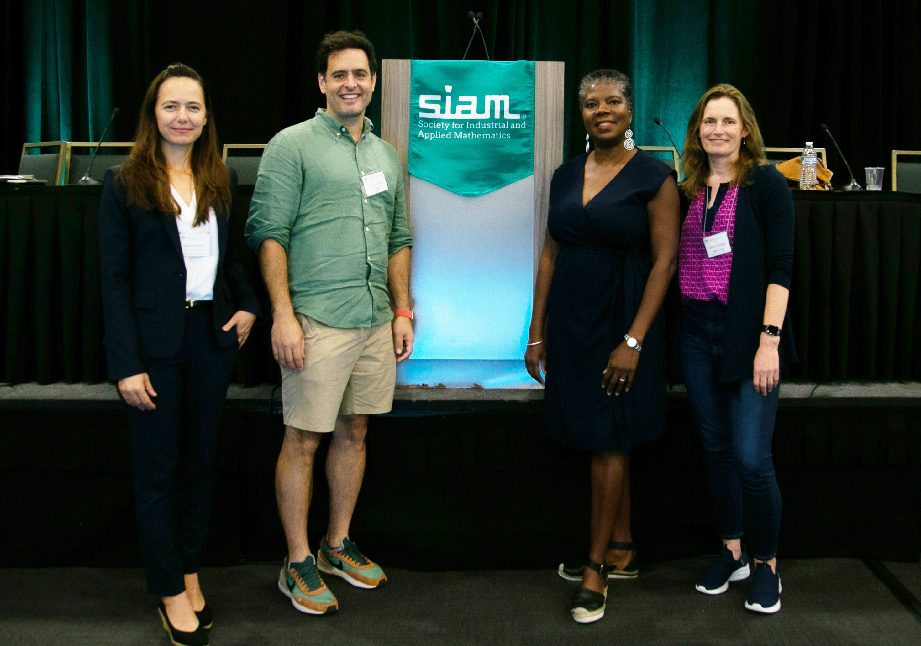 During the 2022 SIAM Conference on Mathematics of Data Science, which took place in San Diego, Calif., in September, a panel discussion offered valuable insights to students and early-career researchers who are contemplating future employment. From left to right: moderator Noemi Petra (University of California, Merced) and panelists Marco Cuturi (Apple, Inc.), Suzanne Weekes (executive director of SIAM), and Tamara Kolda (MathSci.ai). SIAM photo.