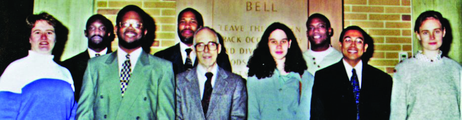 Jim McKenna (center) with his mentees and “grandmentees” at the CRFP-GRPW 25th Anniversary Celebration, which was held at the headquarters of Lucent Technologies in January 1998. Photo courtesy of William Massey.