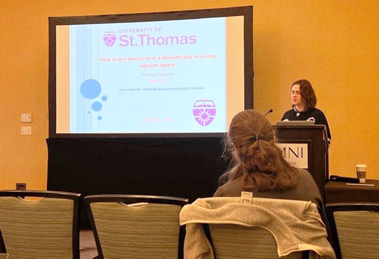 Author Natasa Dragovic of the University of St. Thomas presents her research about opinion dynamics in the context of elections during a minisymposium session at the 2025 SIAM Conference on Computational Science and Engineering, which took place in Fort Worth, Texas, earlier this year. Photo courtesy of Natasa Djurdjevac Conrad.