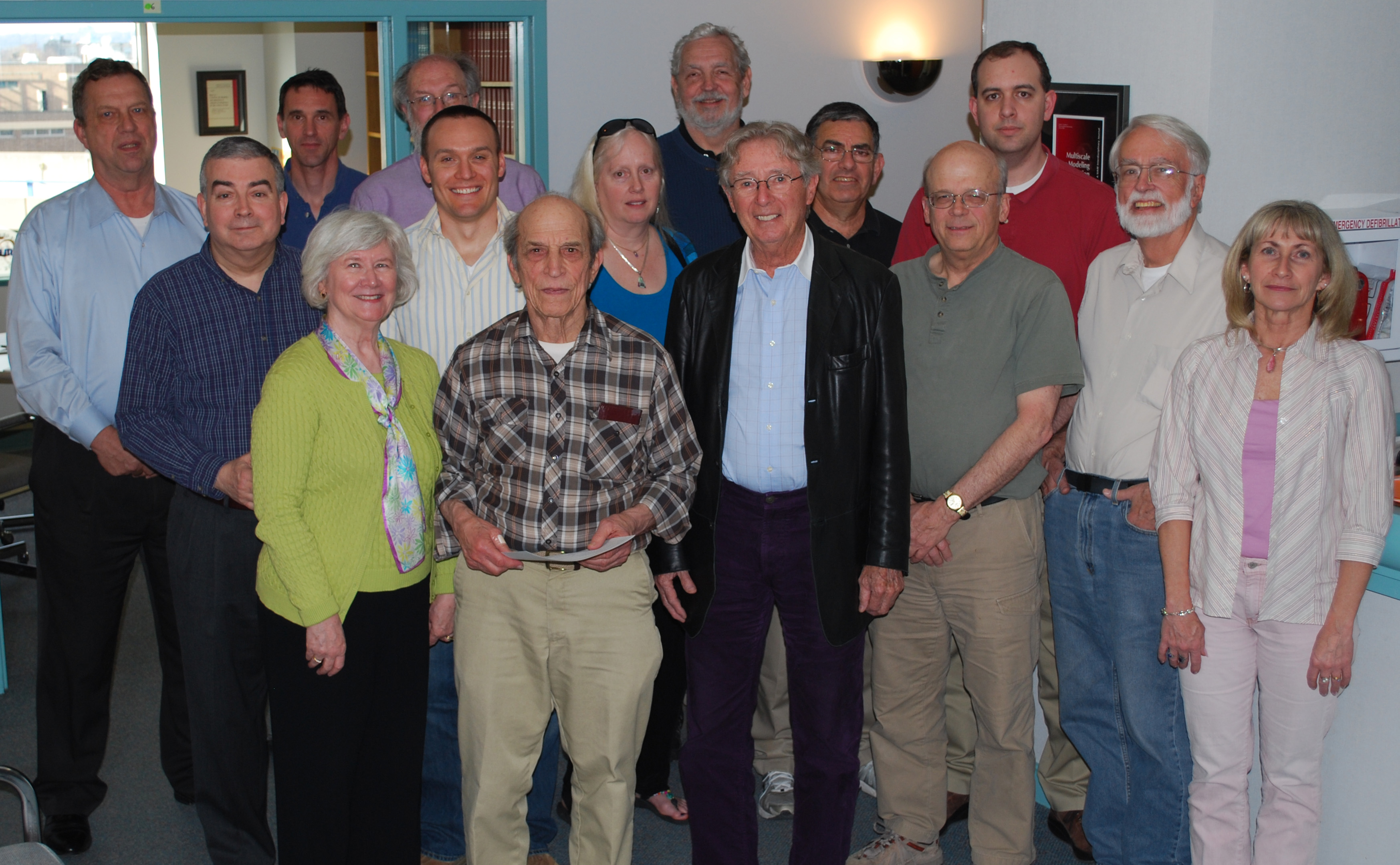 Judges of the 2011 MathWorks Math Modeling Challenge (M3 Challenge), a program of SIAM, gather at SIAM headquarters in Philadelphia, Pa., to evaluate submitted papers from competing student teams. James Case (seventh from right, in the back) served as both a triage and contention judge for more than 10 years. Photo courtesy of SIAM.
