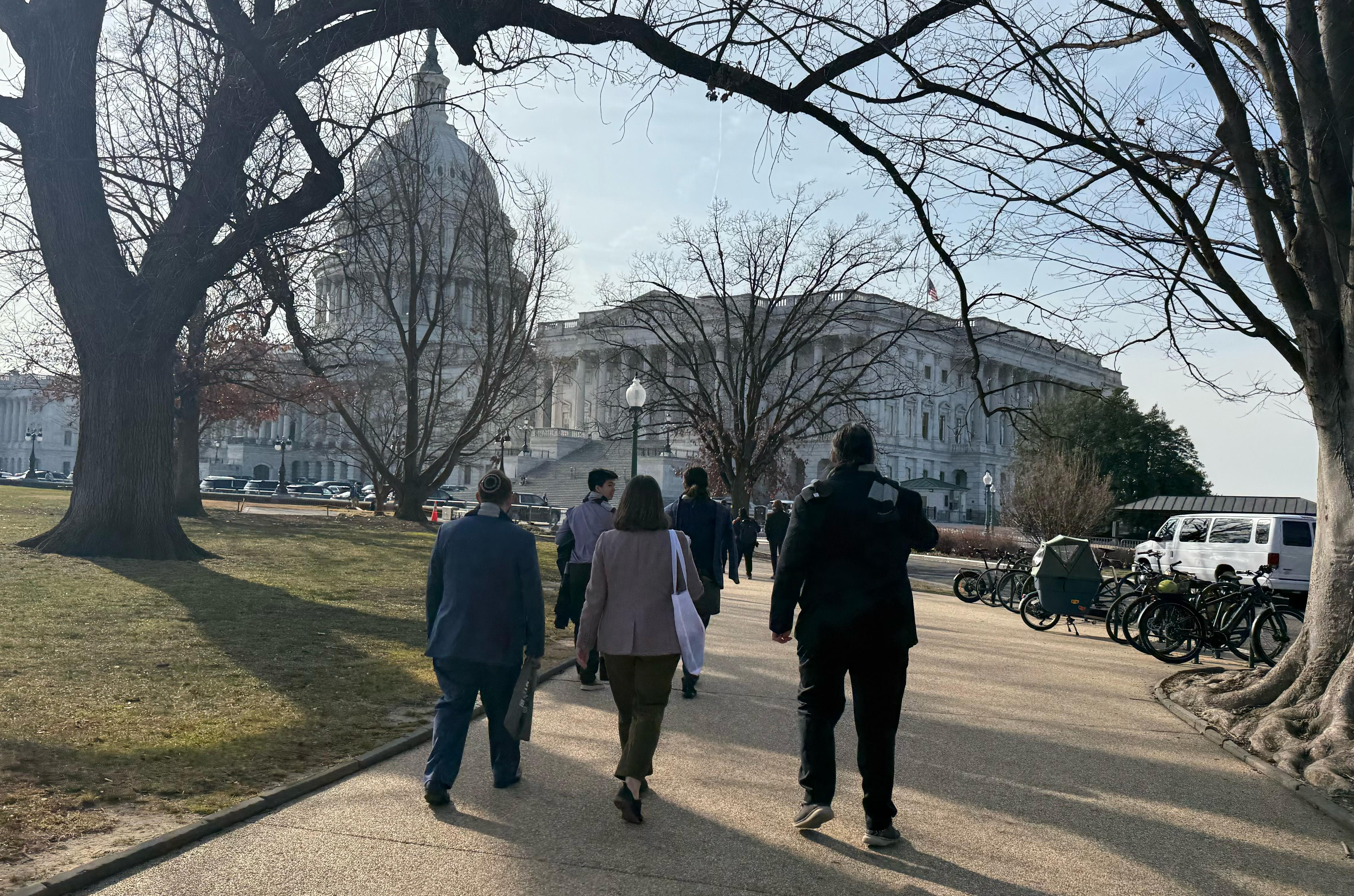 The New Mexico Delegation walks by the U.S. Capitol on their way to meet with the offices of New Mexico's senators during the recent #MathSciOnTheHill advocacy event in Washington, D.C. Photo courtesy of Anita Chou.