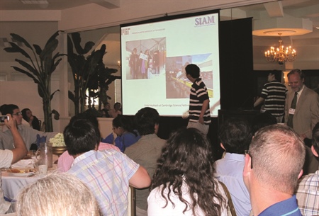 Each year, representatives of SIAM student chapters share their experiences over breakfast at the SIAM Annual Meeting. Shown here are participants in the 2013 event in San Diego. Photo by Susan Whitehouse.