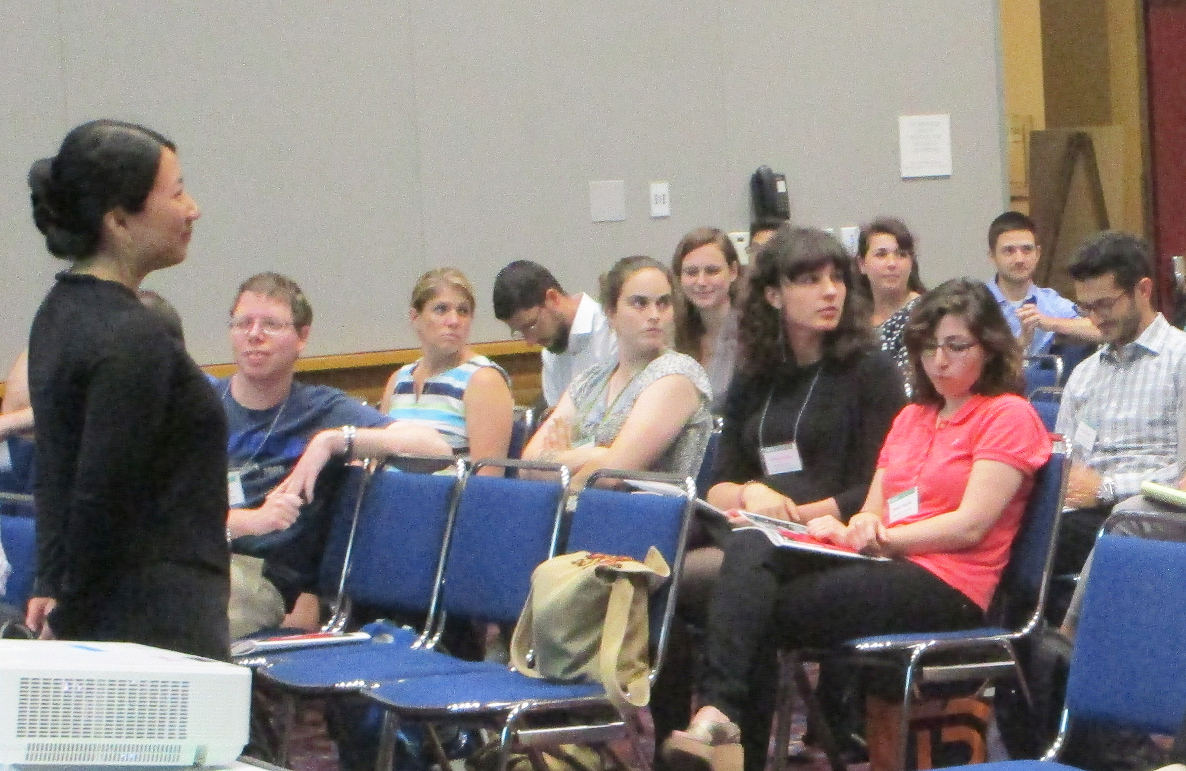 Di Ye of Zhennovate (left) interacts with attendees of the Professional Development Evening at the 2018 SIAM Annual Meeting, held in Portland, Ore., last July. SIAM photo.