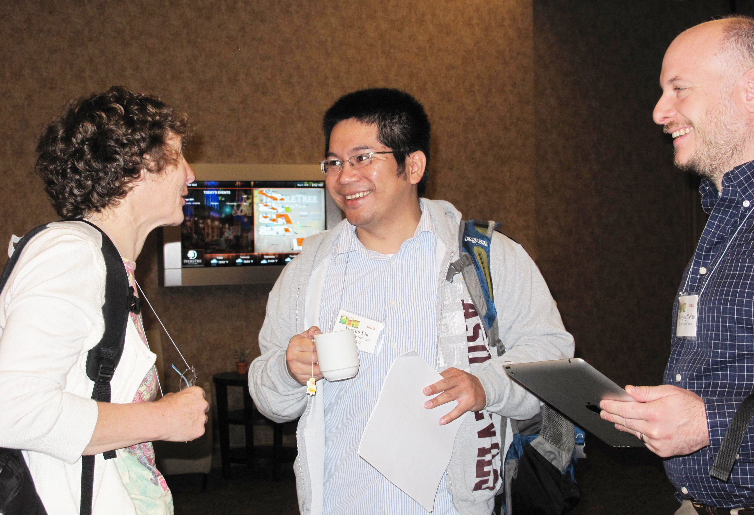 Photos from conferences typically depict happy attendees partaking in purposeful conversation and making lasting connections. SIAM photo.