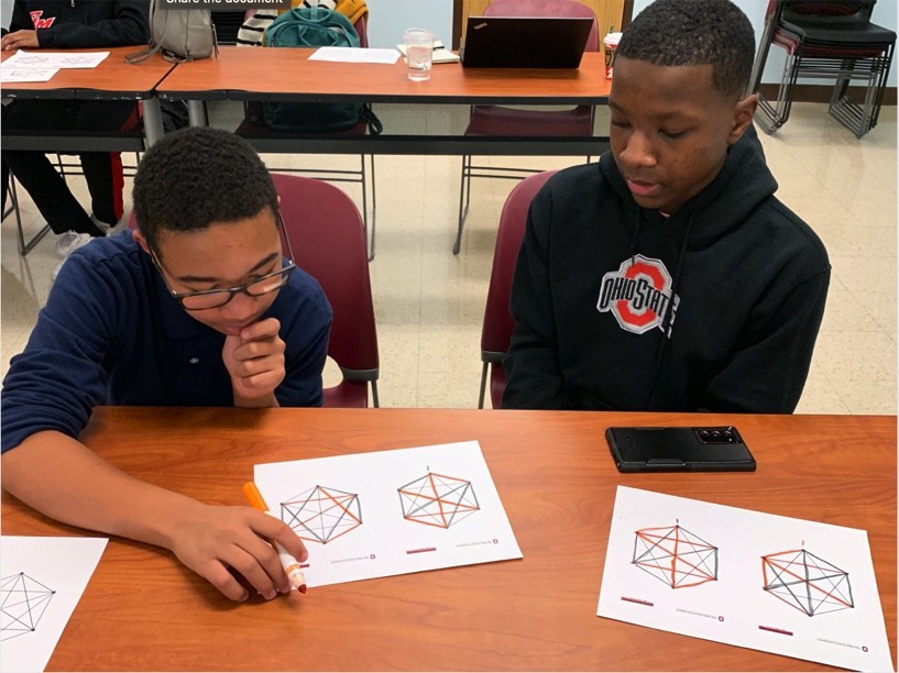 Two students at a “Hidden Figures Revealed” workshop play a matroid-based game that was inspired by the research of Ohio State University alumna Carolyn Mahoney, who was the 25th Black woman in the U.S. to earn a Ph.D. in mathematics. Photo courtesy of Erica Womack.