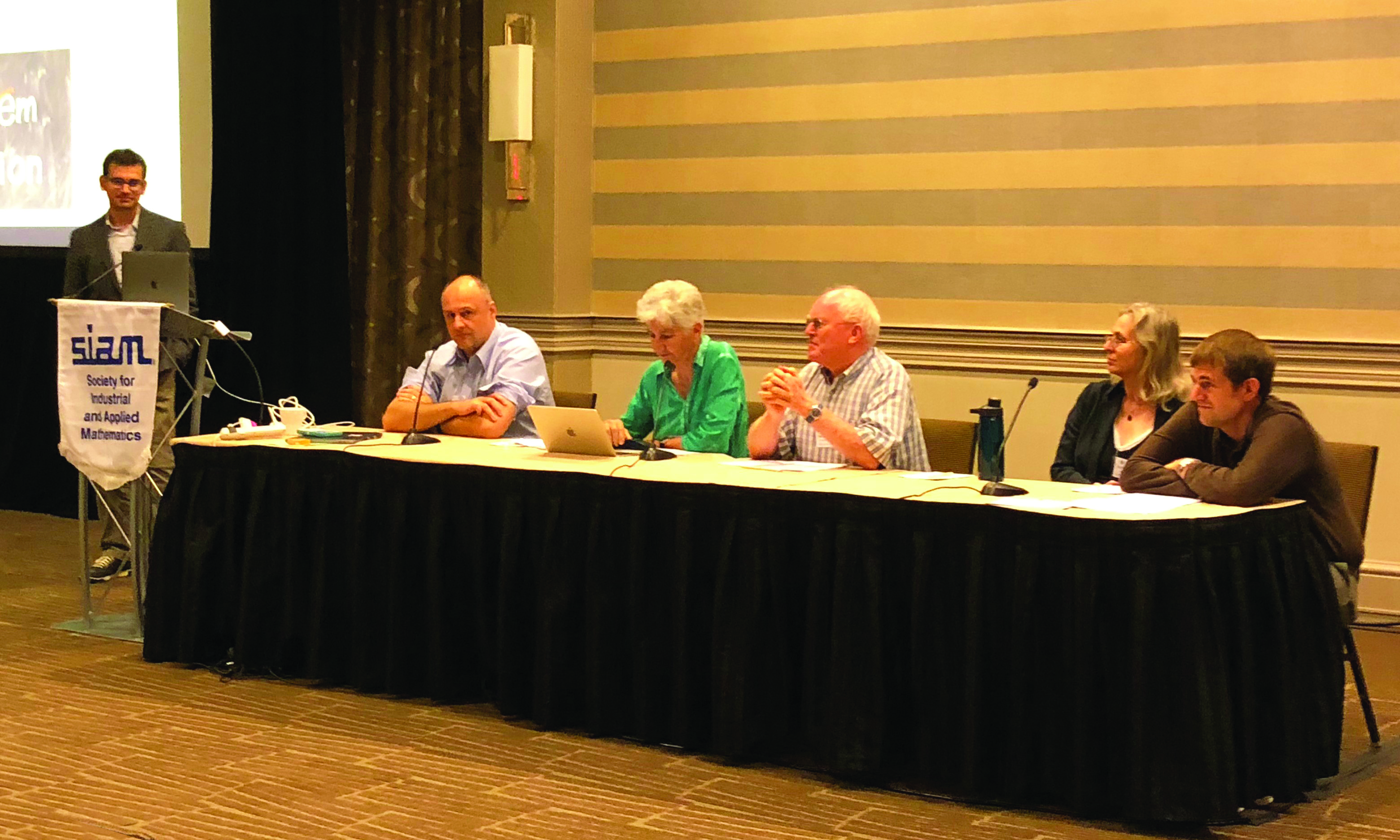 Panelists discuss present and future research at the 2018 SIAM Conference on Mathematics of Planet Earth, which took place in September 2018 in Philadelphia, Pa. From left: moderator Emil Constantinescu (Argonne National Laboratory), Mihai Anitescu (Argonne National Laboratory and The University of Chicago), Christiane Rousseau (Université de Montréal), Hans G. Kaper (Georgetown University), Beth Wingate (University of Exeter), and Jon Hobbs (Jet Propulsion Laboratory). Photo credit: Katie Kavanagh.