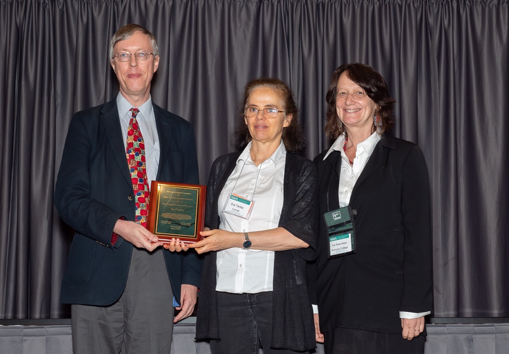 Eva Tardos (center) of Cornell University received her plaque for the AWM-SIAM Sonia Kovalevsky Lecture from SIAM President Nick Higham (left) and AWM President Ami Radunskaya at the 2018 SIAM Annual Meeting.