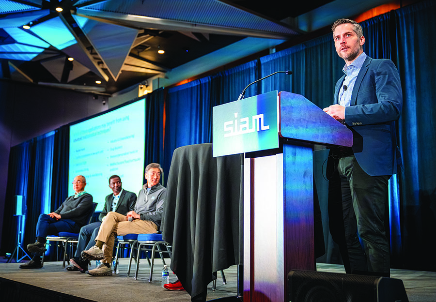 Boris Kramer of the University of California, San Diego, speaks about the important role of artificial intelligence, machine learning, and other emerging technologies in the computational science and engineering space during a panel session at the 2025 SIAM Conference on Computational Science and Engineering, which was held in Fort Worth, Texas, this past March. Background, left to right: panelists Raymond Honfu Chan of Lingnan University, Gilles Gnacadja of Amgen, and Jungsang Kim of Duke University. SIAM photo.