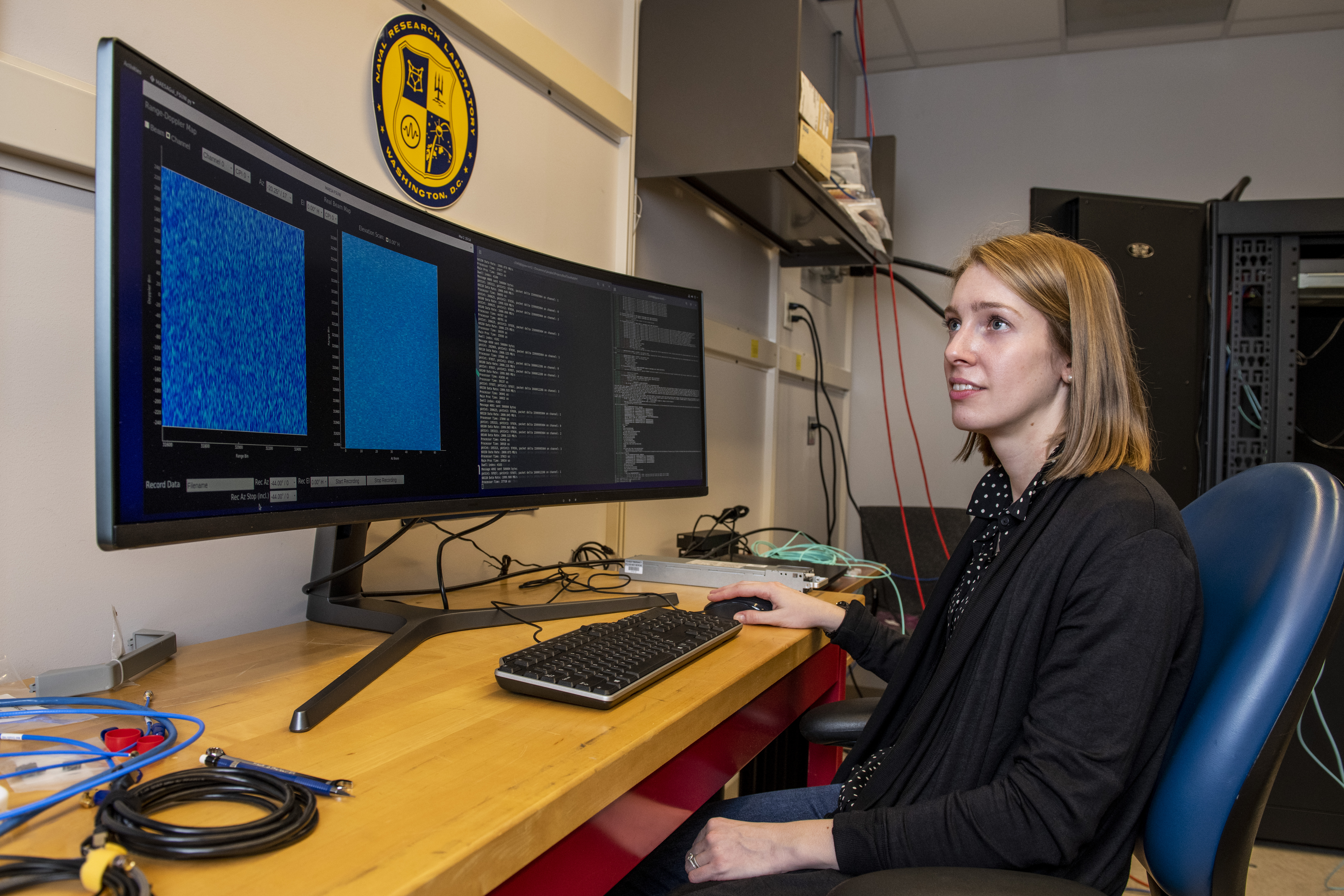 Tegan Webster, a mathematician at the U.S. Naval Research Laboratory (NRL) and head of the Radar Division’s Distributed Sensing Section, analyzes the graphical user interface of the Multichannel Active Electronically Scanned Array (MAESA) radar testbed in Washington, D.C. The MAESA system transmits, receives, processes, and visualizes data for research and development in radar technology. U.S. Navy photo courtesy of Sarah Peterson.