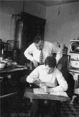 Phil Davis, age 14, works on Napoleon’s Theorem in his family’s kitchen during the winter of 1936. His father looks on and wonders what it’s all about. This photo appears at the front of Phil’s 1997 book, Mathematical Encounters of the Second Kind. Image courtesy of Birkhäuser.