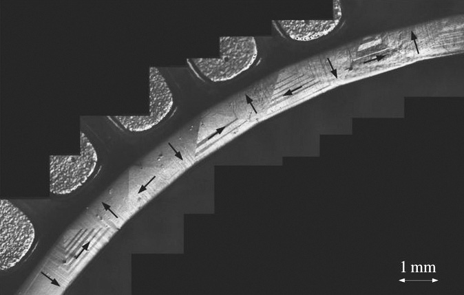 &lt;strong&gt;Figure 2.&lt;/strong&gt; Bending by phase transformation of the tetragonal phase of a single crystal from a NiMnGa alloy. The arrows depict the direction of magnetization. Figure courtesy of [5].