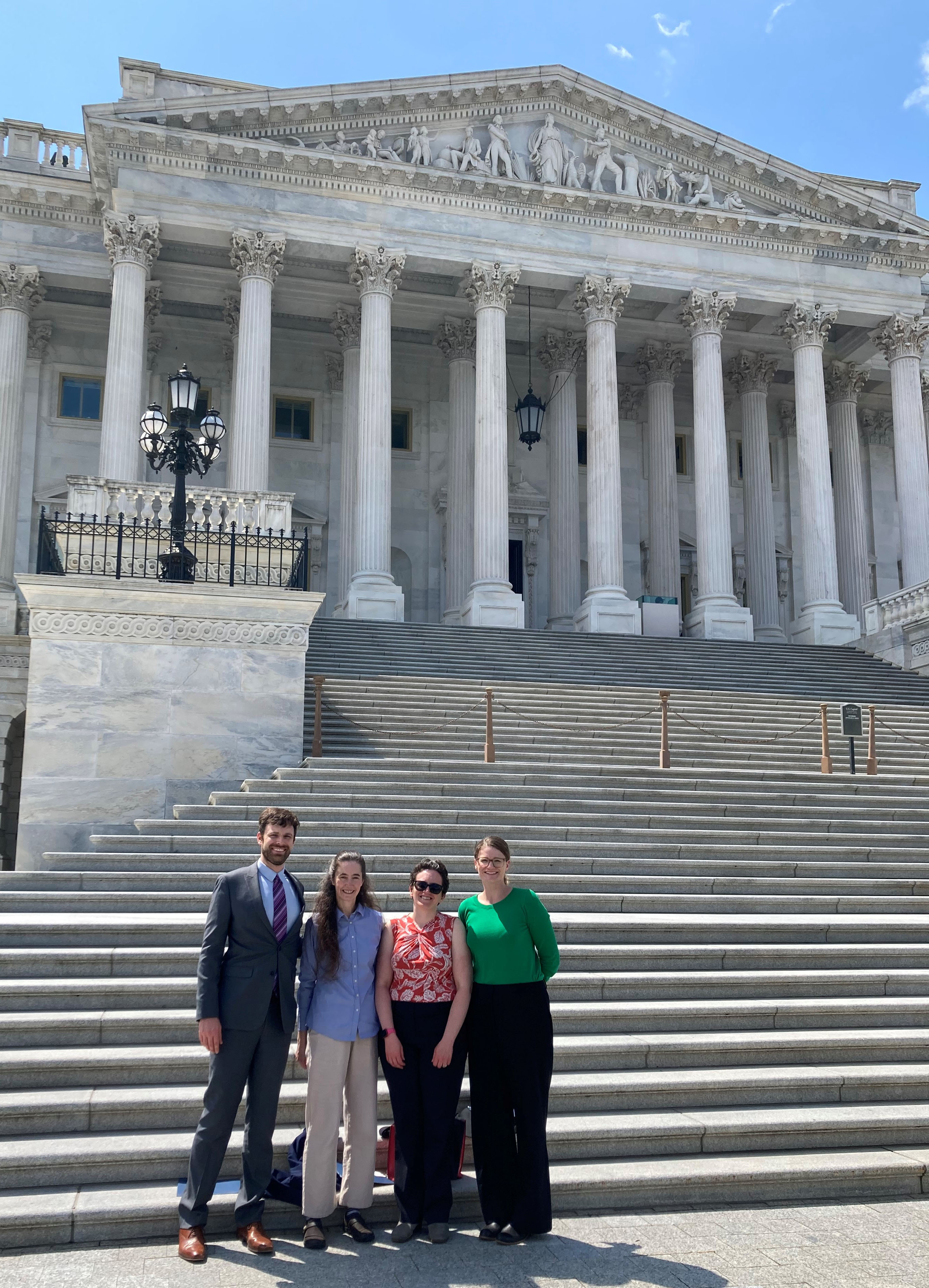 Attendees of the 2024 spring meeting of the SIAM Committee on Science Policy (CSP) pose in front of the U.S. Capitol in Washington, D.C., while conducting congressional visits. From left to right: Jake Price of the University of Puget Sound (2023 SIAM Science Policy Fellow), Emily Evans of Brigham Young University (member of the CSP and former SIAM Science Policy Fellow), Miriam Quintal of Lewis-Burke Associates, and Arielle Carr of Lehigh University (2024 SIAM Science Policy Fellow). Photo courtesy of Miriam Quintal.