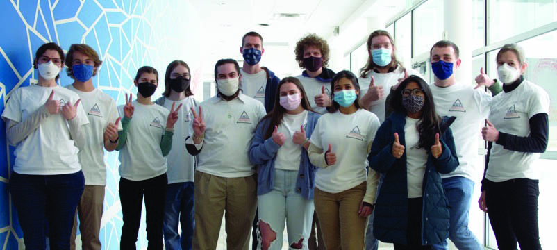 Members of the Mines Mathematics and Computing Collaborative (MMCC) at the Colorado School of Mines. From left to right: Soraya Terrab, Owen Ruggeri, Miranda Manfre, Cameron Kelly, Justin Garrish, Samuel Koller, Leah Bandy, Ethan Lewellin, Jacqueline del Castillo, Tyler Dendy, Sweta Rai, Ian Stonecypher, and Jennifer Ryan (faculty advisor). Photo courtesy of Soraya Terrab.