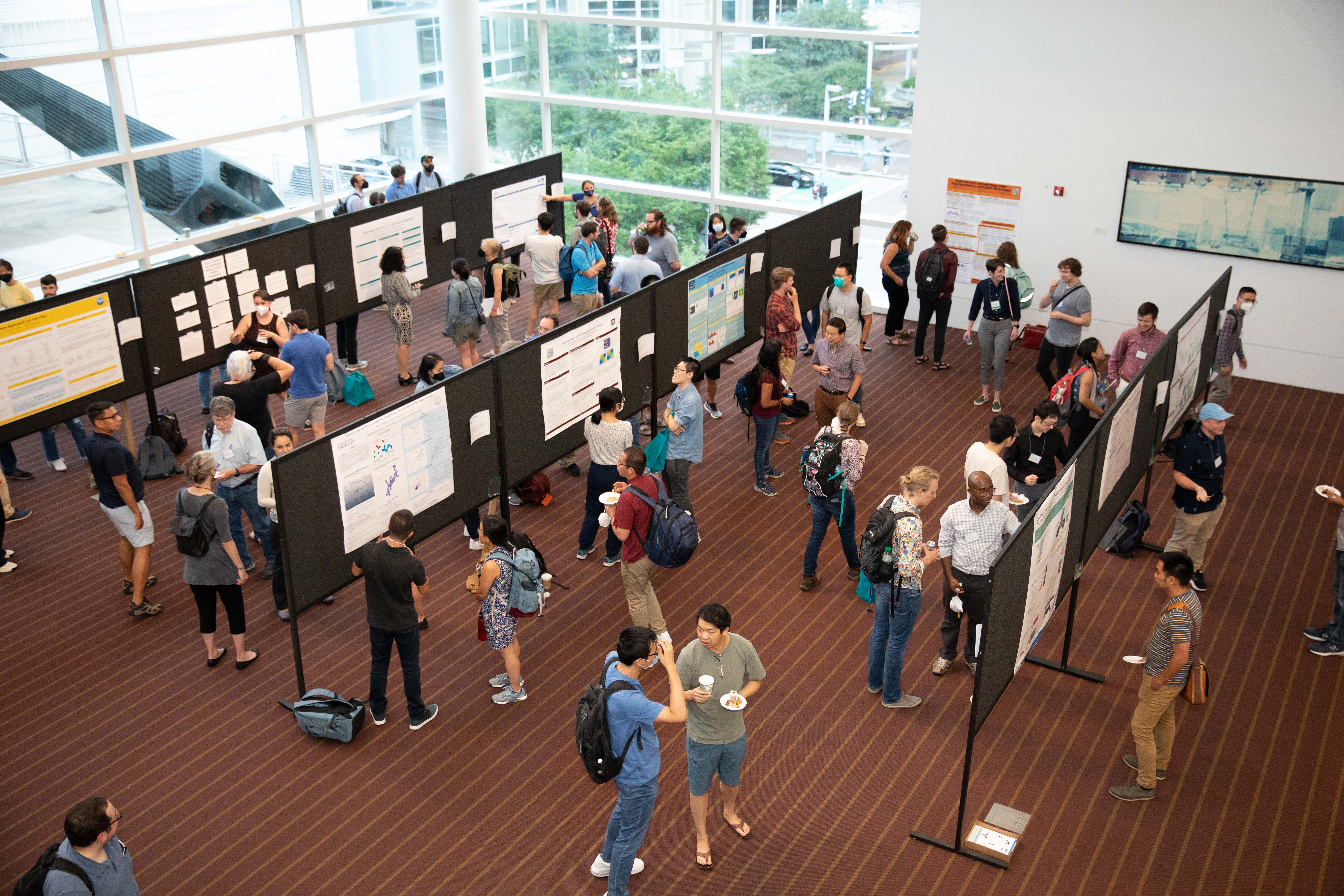 Attendees of the 2022 SIAM Annual Meeting, which took place in a hybrid format in Pittsburgh, Pa., in July 2022, network and mingle during the Poster Session. SIAM photo.