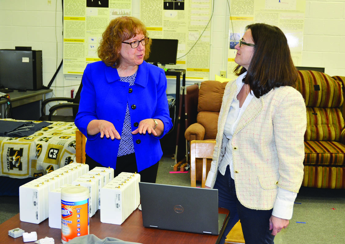 Giovanna Guidoboni (right) and Marge Skubic of the University of Missouri discuss the design and optimization of sensors for cardiopulmonary monitoring in assisted living facilities. Guidoboni’s involvement in this project—which constituted her first consulting job—was based on her cardiovascular monitoring patent. Photo courtesy of the University of Missouri.