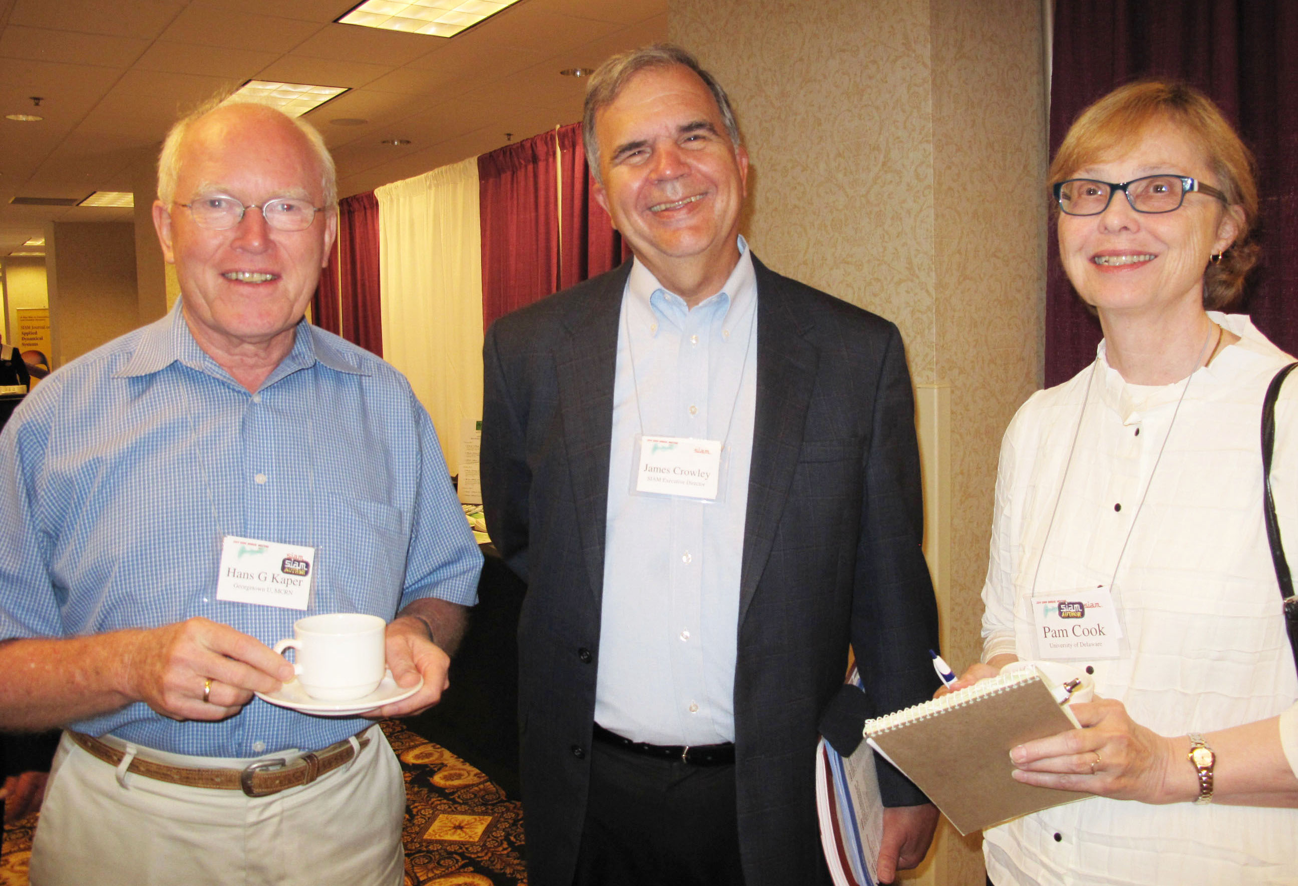 From left to right: SIAM News editor-in-chief Hans Kaper (Georgetown University), Jim Crowley, and past president Pam Cook (University of Delaware) at the 2014 SIAM Annual Meeting, which was held in Chicago, Ill. SIAM photo.