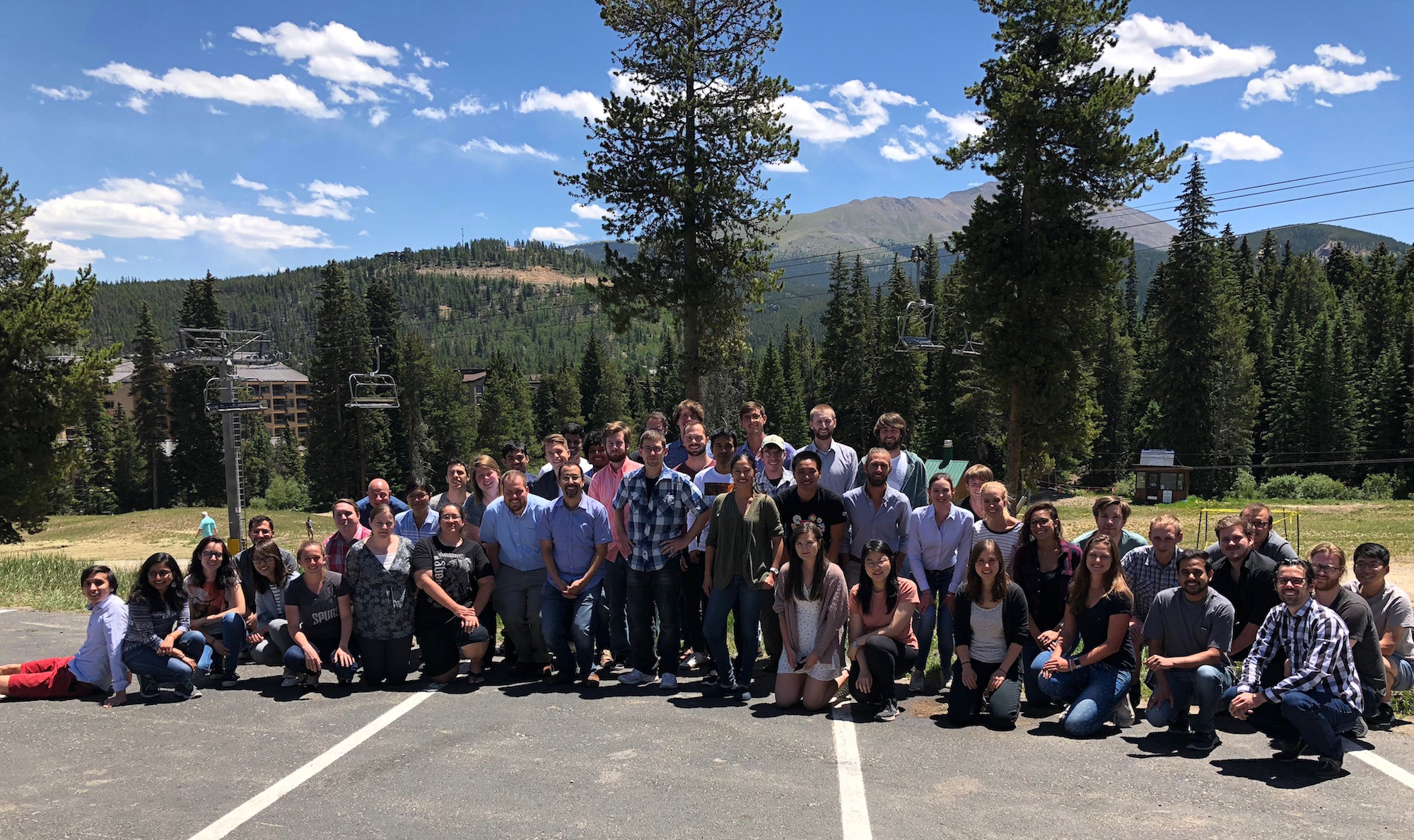 The entire 2018 Gene Golub SIAM Summer School team poses in the shape of a Gaussian curve in Breckenridge, Colo. Photo credit: Georg Stadler.