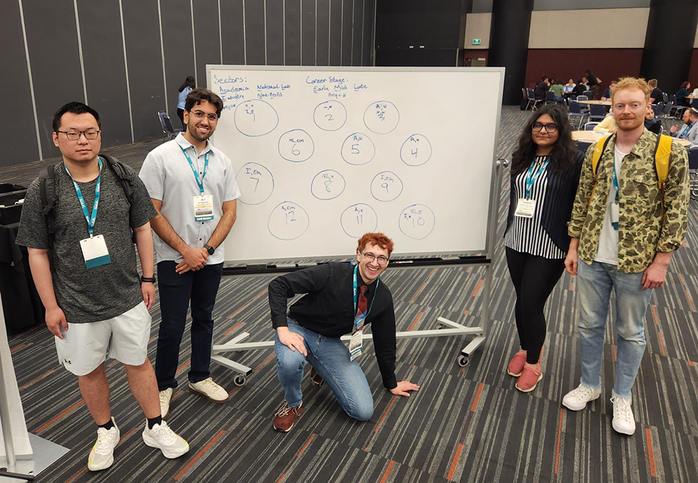 At the Third Joint SIAM/CAIMS Annual Meetings, which took place this summer in Montréal, Québec, Canada, volunteer helpers assist with the Career Opportunity Committee’s resume-building workshop, which offered attendees one-on-one mentoring sessions. From left to right: Xiangrui Kong (University of British Columbia), Ali Balooch (University of Nevada, Las Vegas), Jason Torchinsky (Sandia National Laboratories), Pardis Semnani (University of British Columbia), and Lane Rogers (University of Tennessee, Knoxville). SIAM photo.