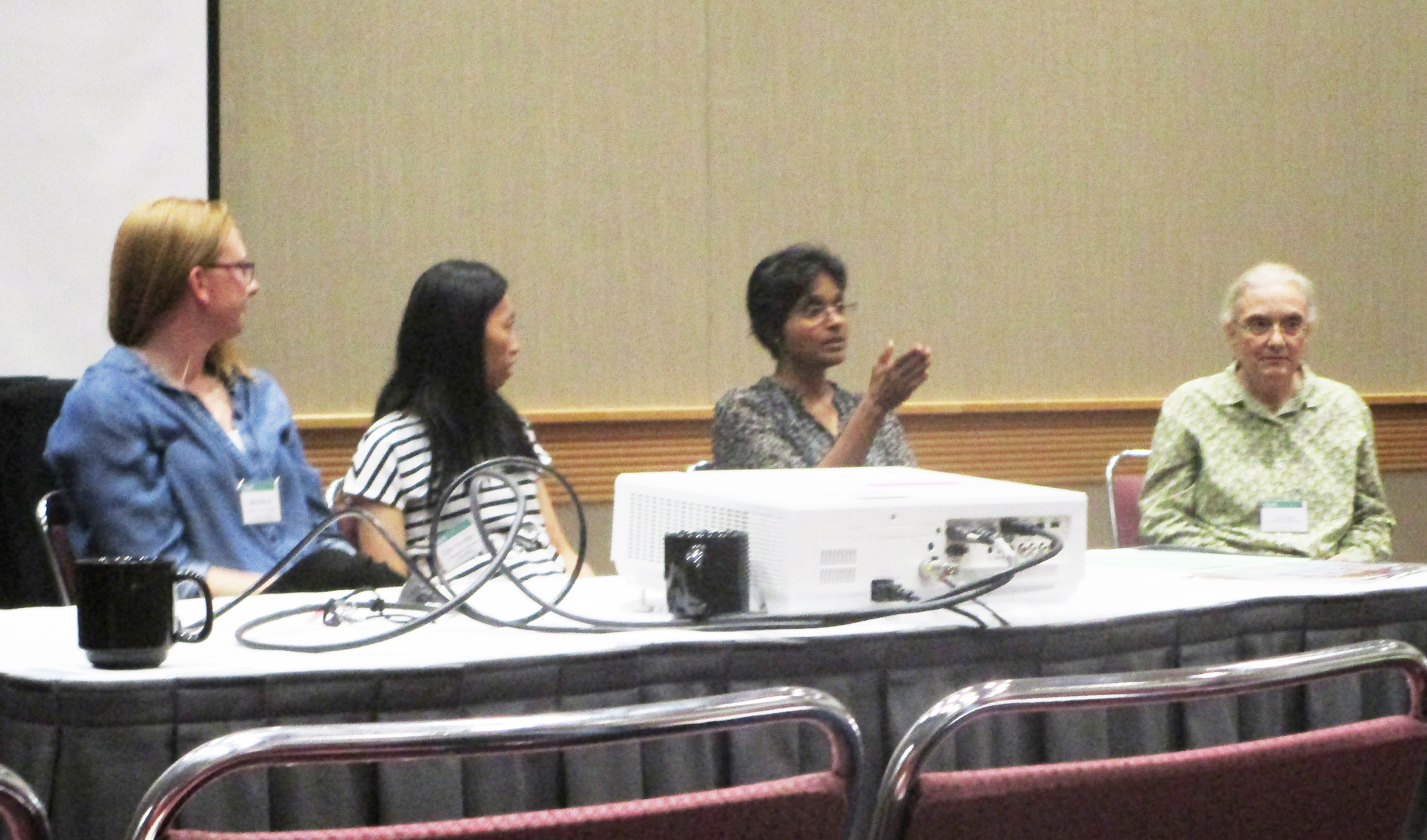 From left: Laina Mercer (Institute for Disease Modeling), Chiu-Yen Kao (Claremont McKenna College), Lalitha Venkataramanan (Schlumberger-Doll Research), and Nina Amenta (University of California Davis) address the audience during the Association for Women in Mathematics workshop panel, which took place at the 2018 SIAM Annual Meeting in Portland, Ore., this July. SIAM photo.