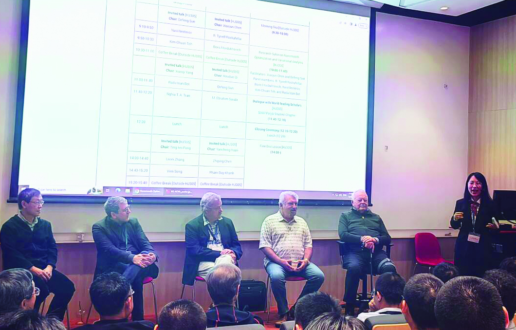 During the Hong Kong Polytechnic University (PolyU) SIAM Student Chapter’s “Dialogue with World-leading Scholars,” experts in optimization shared insights and advice based on their own career experiences. From left to right: panel members Kim-Chuan Toh (National University of Singapore), Radu Ioan Boţ (University of Vienna), Yurii Nesterov (Université Catholique de Louvain), Boris Mordukhovich (Wayne State University), and R. Tyrrell Rockafellar (University of Washington), as well as moderator Yixuan Zhang (president of the PolyU SIAM Student Chapter). Photo courtesy of Xin Qu.