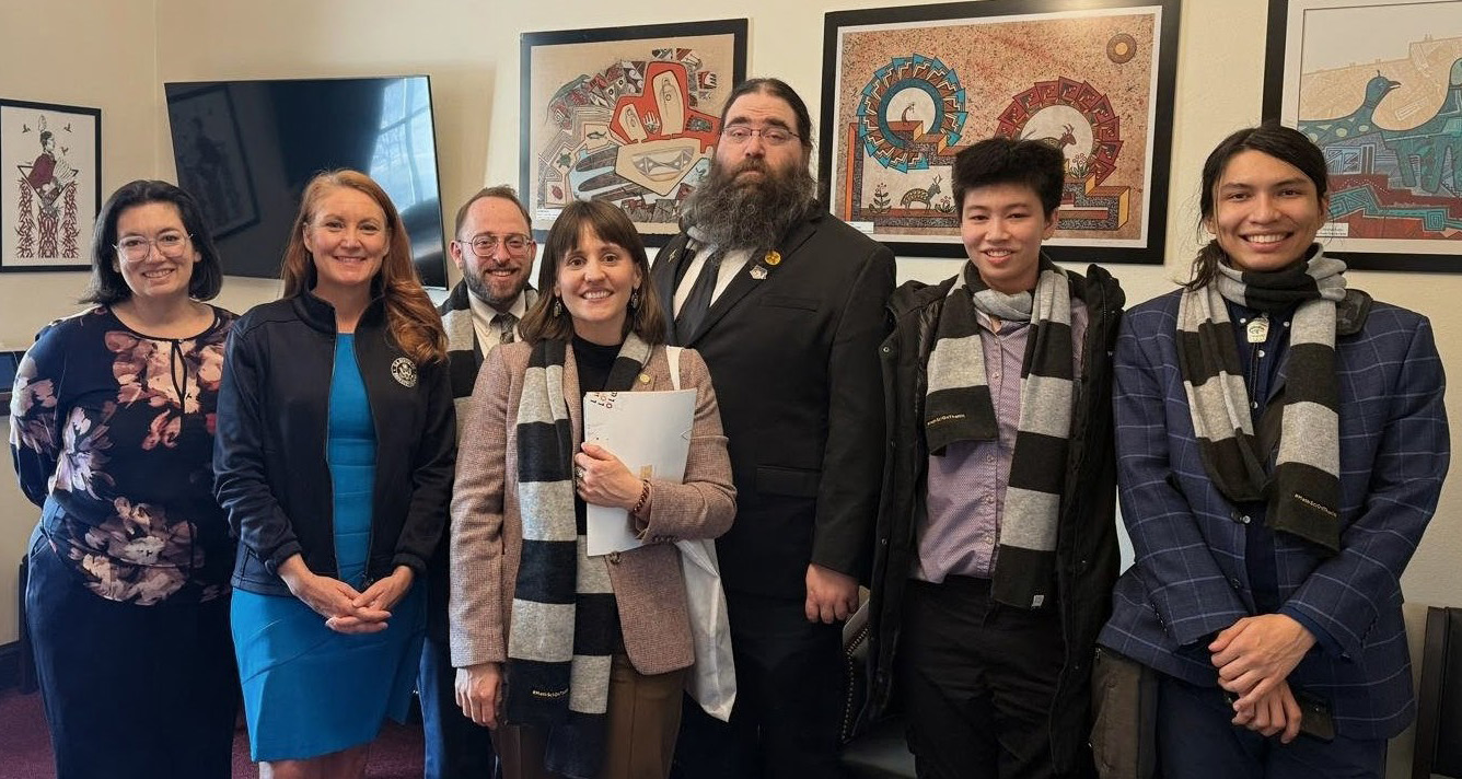 Members of the New Mexico Delegation meet with Rep. Melanie Stansbury (D-NM) during the #MathSciOnTheHill advocacy event, which took place on Capitol Hill in Washington, D.C., after the Joint Mathematics Meetings in January. From left to right: Anita Chou (CAMP for Algorithmic and Mathematical Play), Rep. Stansbury (D-NM), Jonas Actor (Sandia National Laboratories), Anna Nelson (University of New Mexico), Nick Allgood (U.S. Air Force Research Laboratory), Isa Chou (Williams College), and Tommy Denny-Martins (Purdue University). Photo courtesy of Anita Chou.