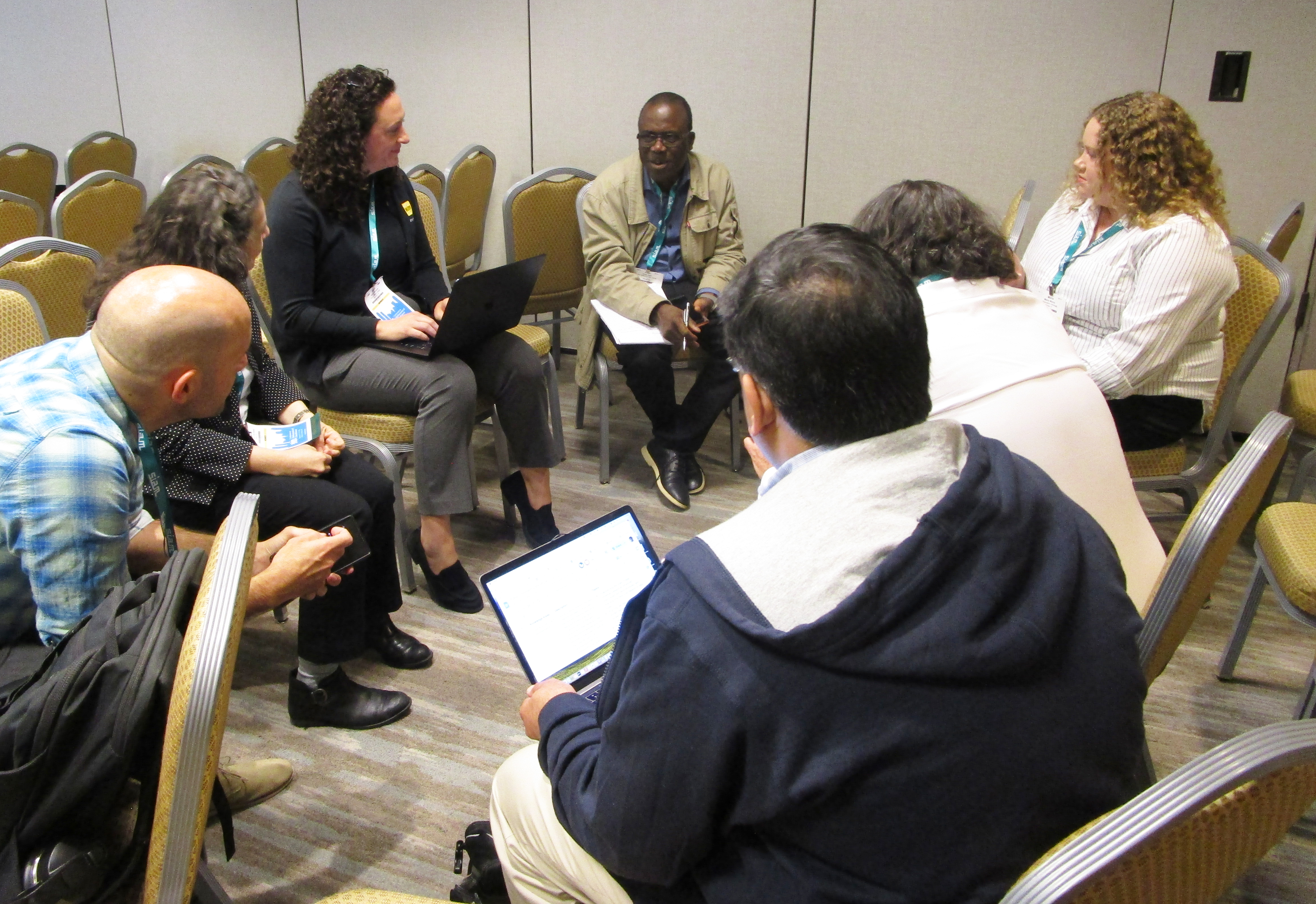 Attendees of the 2024 SIAM Conference on Mathematics of Data Science form breakout groups to discuss their respective interpretations of data science.