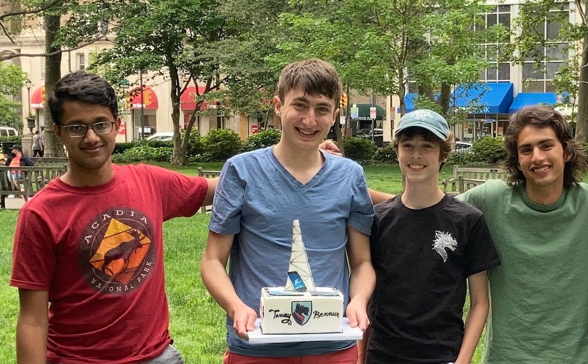 The senior members of Julia R. Masterman Demonstration and Laboratory School’s 2021 MathWorks Math Modeling Challenge (M3 Challenge) team hold a cake that commemorates their impressive performance at an end-of-year math party in Philadelphia, Pa., in May 2021. The team finished in the top six and was honored as a finalist. From left to right: Tanay Bennur, Ethan Soloway, Tobias Beidler-Shenk, and Owen Moss. Junior team member Hayden Gold is not pictured. Photo courtesy of Kathryn Smith.