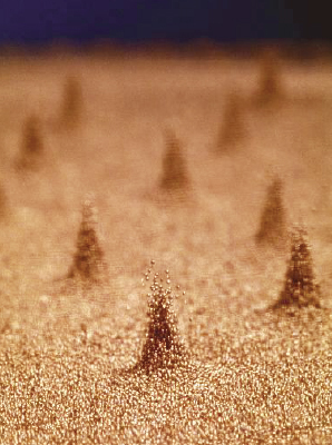 &lt;strong&gt;Figure 1.&lt;/strong&gt; Pillars of vibrating copper beads are much higher than the surrounding material and appear to stand independently of each other. Image courtesy of [4].