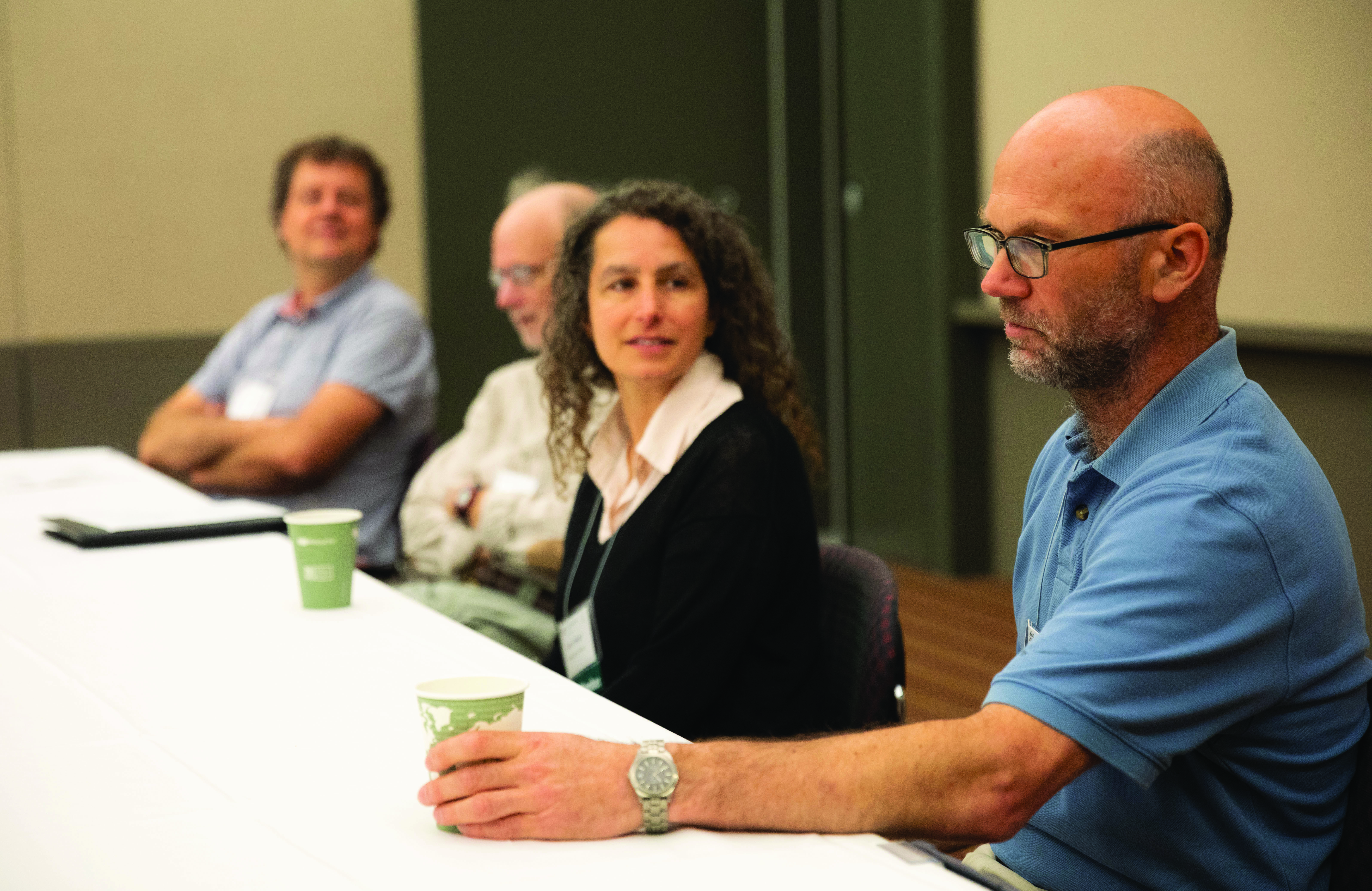 A panel at the 2022 SIAM Annual Meeting, which took place in Pittsburgh, Pa., last year, addressed various aspects of the writing and review process for journal papers. From left to right: Hans De Sterck (University of Waterloo), Howard Elman (University of Maryland), Evelyn Sander (George Mason University), and Mark Ainsworth (Brown University) offer advice to students and early-career researchers. SIAM photo.