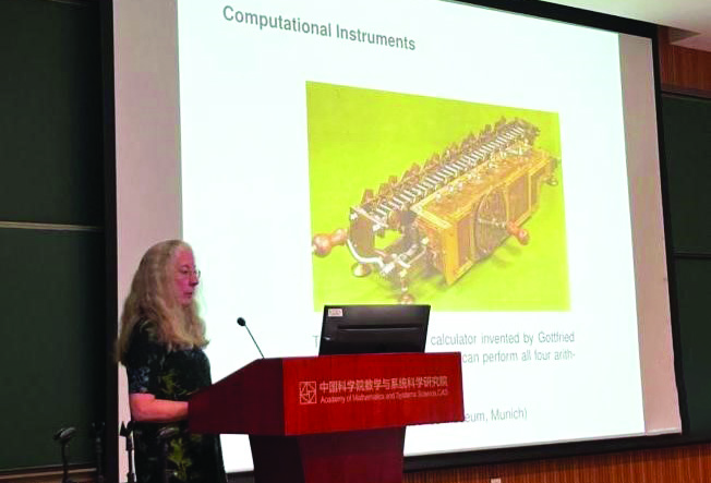 SIAM Past President Susanne Brenner of Louisiana State University overviews historical computational instruments during the 13th Annual Meeting of the Chinese Academy of Sciences SIAM Student Chapter, which was held in July 2024. Photo courtesy of Yan Yang.