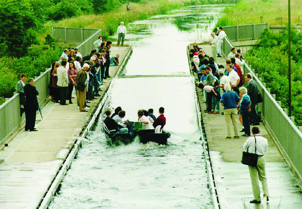 &lt;strong&gt;Figure 1.&lt;/strong&gt; On July 12, 1995, an international gathering of scientists witnessed a re-creation of John Scott Russell’s famous “first” sighting of a solitary wave on the Union Canal near Edinburgh, Scotland. Photo reproduced with permission from the Department of Mathematics at Heriot-Watt University in Edinburgh.