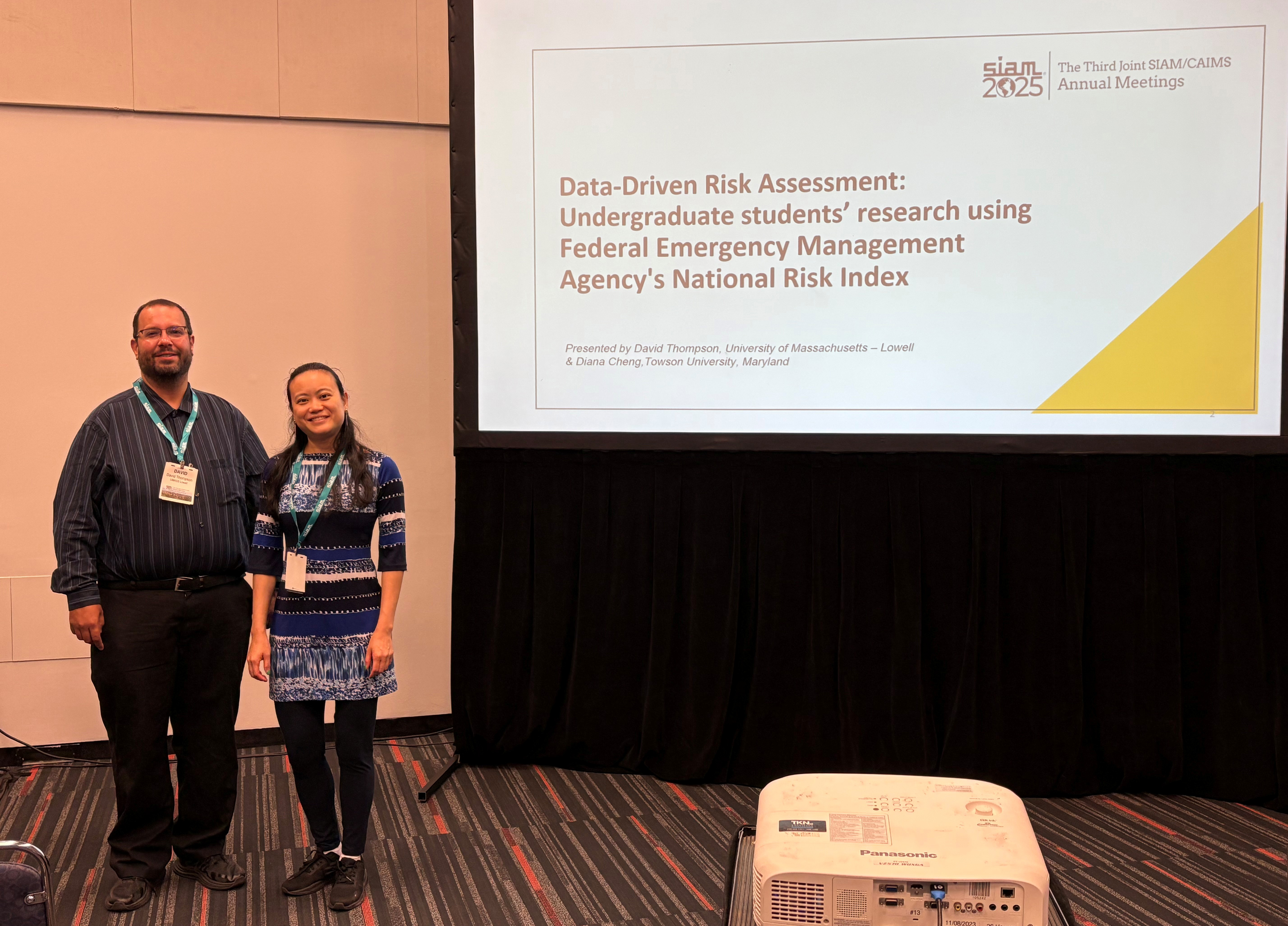 David Thompson of the University of Massachusetts Lowell and Diana Cheng of Towson University pose during Thompson’s presentation at the Third Joint SIAM/CAIMS Annual Meetings, which is currently taking place in Montreal, Canada. Photo courtesy of Diana Cheng.