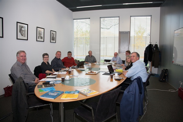 As the program for the IMA workshop described in the accompanying article was taking shape, SIAM met in Amsterdam with leaders of European mathematics-in-industry efforts. Shown here are, clockwise from left: Wil Schilders (representing the European Consortium for Mathematics in Industry), Maria Esteban (SMAI), Volker Mehrmann (GAMM), Mario Primicerio (SIMAI), and, from SIAM: vice presidents for industry Thomas Grandine (current) and Kirk Jordan (former), vice president for programs Sven Leyffer, president Irene Fonseca, and executive director James Crowley. Topics discussed were drawn in part from publications shown in the foreground, including Mathematics and Industry and European Success Stories in Industrial Mathematics (European Science Foundation/European Mathematical Society) and SIAM’s updated (2012) Mathematics in Industry report.