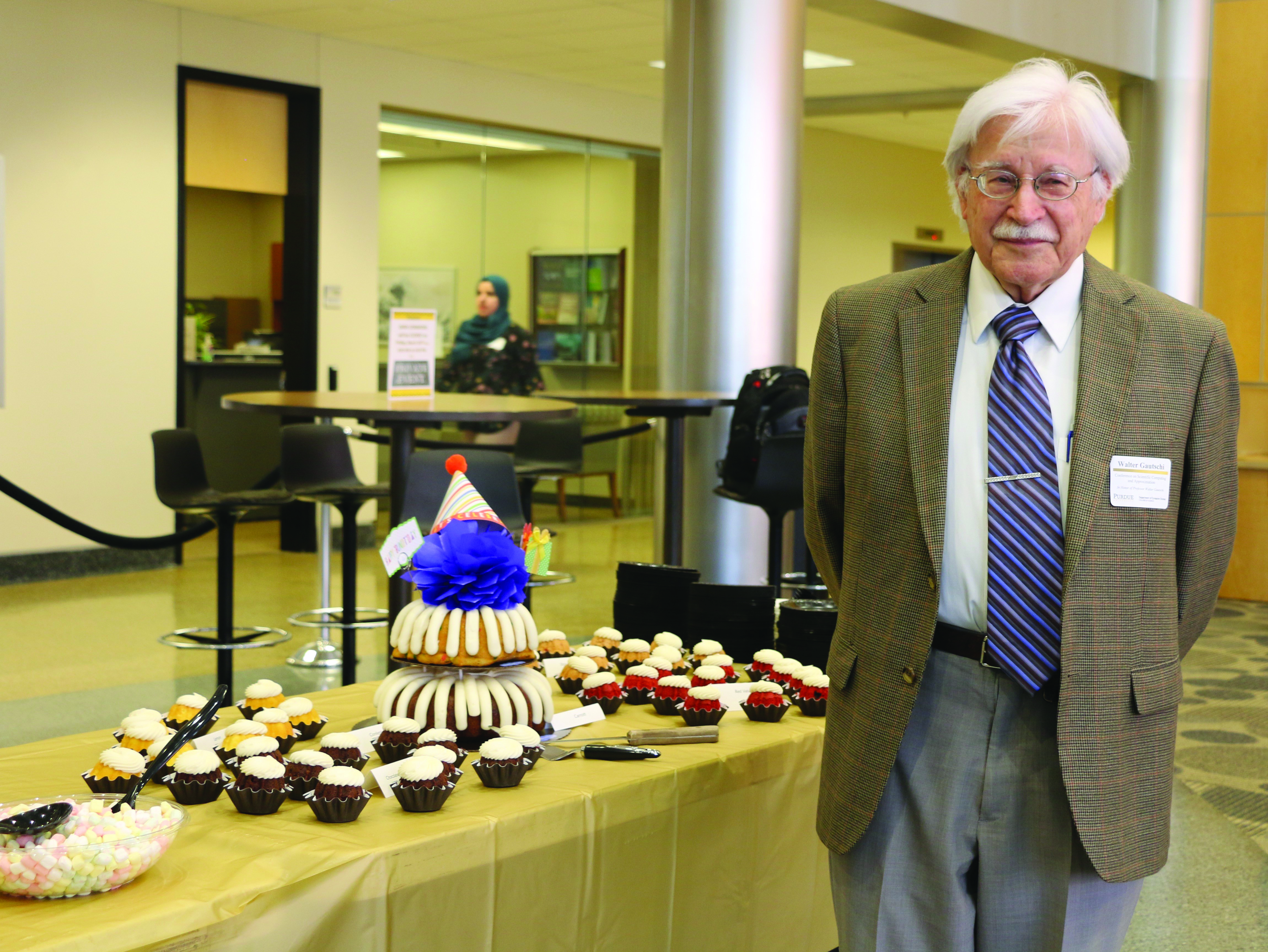 Walter Gautschi celebrates his 90th birthday at the Purdue Conference on Scientific Computing and Approximation, which was held in his honor earlier this year. Image credit: Kristyn R. Childres.