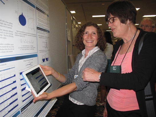 Anna Lieb (left), a fourth-year PhD student in applied mathematics at the University of California, Berkeley with AWM executive director Magnhild Lien. Lieb is presenting her poster on “Optimizing Intermittent Water Supply,&quot; will participate in the AAAS Mass Media Science &amp; Engineering Fellows program in the summer of 2015.