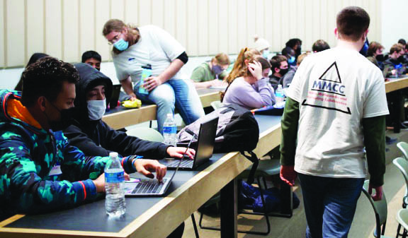 Local middle and high schoolers from Denver, Colo., partake in a financial mathematics workshop about the compound interest model. The Mines Mathematics and Computing Collaborative (MMCC), a student-led outreach organization at the Colorado School of Mines, hosted the workshop in February 2022. Photo courtesy of Soraya Terrab.